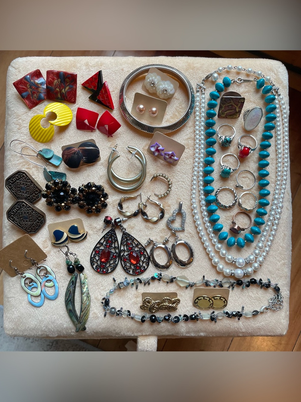 Retro fashion jewelry in a vintage tea tin box .